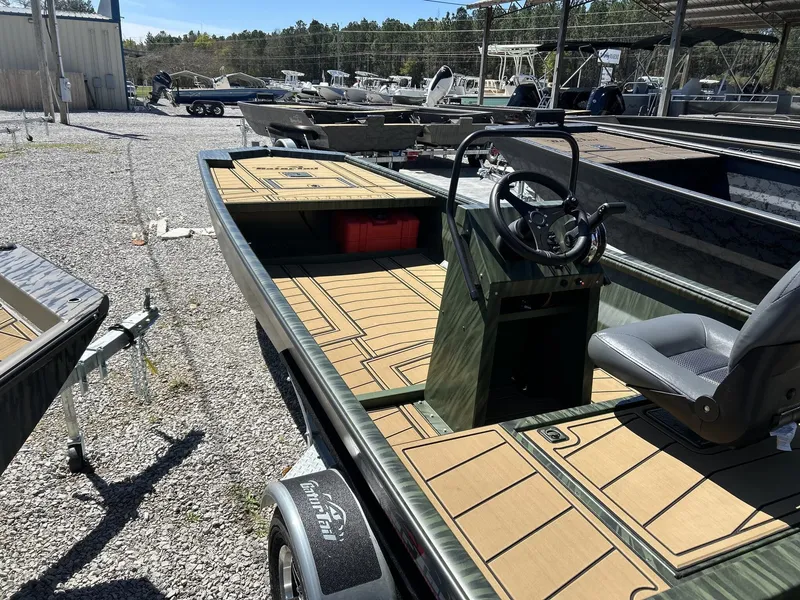 Slide: The Image of 2026 Gator Tail Extreme Series 20x60 CC boat on gravel lot. - 4