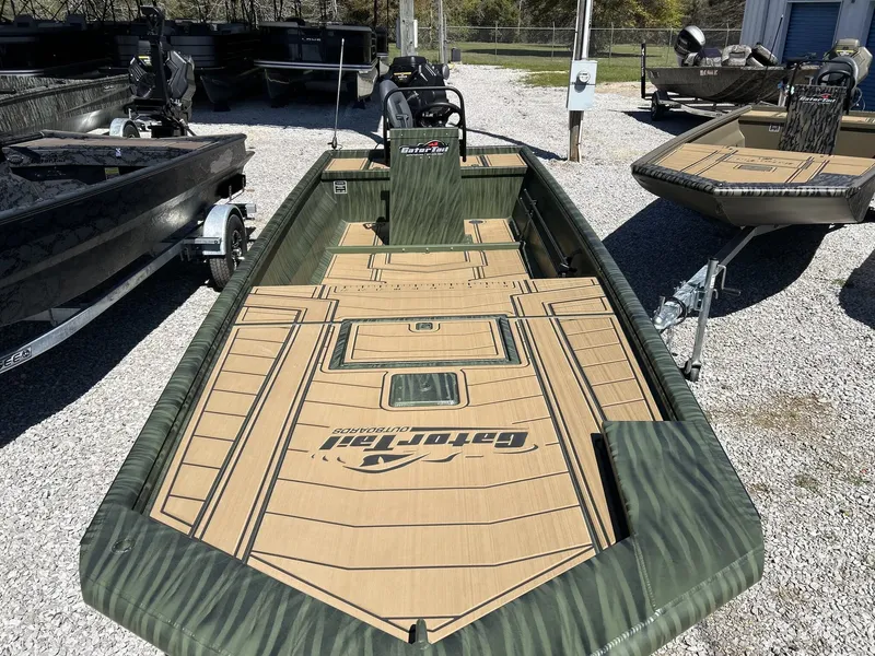 Slide: The Image of Gator Tail Extreme Series 20x60 CC boat, 2026 model, on gravel lot. - 5