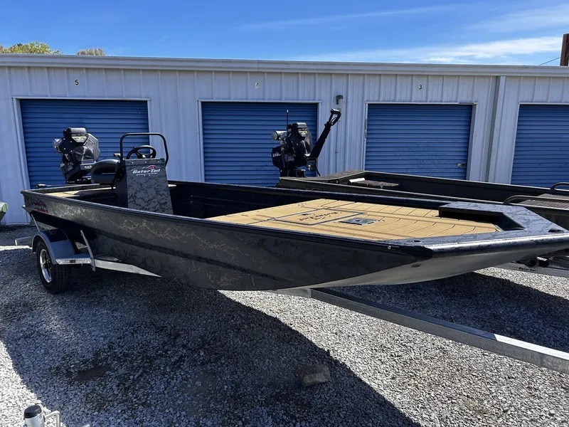 The Image of Gator Tail Extreme Series 20x60 CC boat, 2026 model, on trailer in front of storage units. - 1