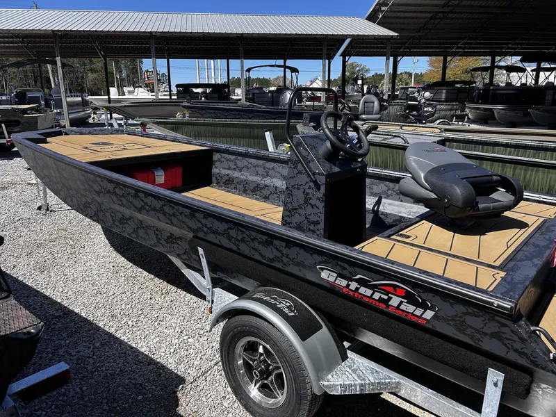 Slide: The Image of 2026 Gator Tail Extreme Series 20x60 CC boat on trailer. - 3