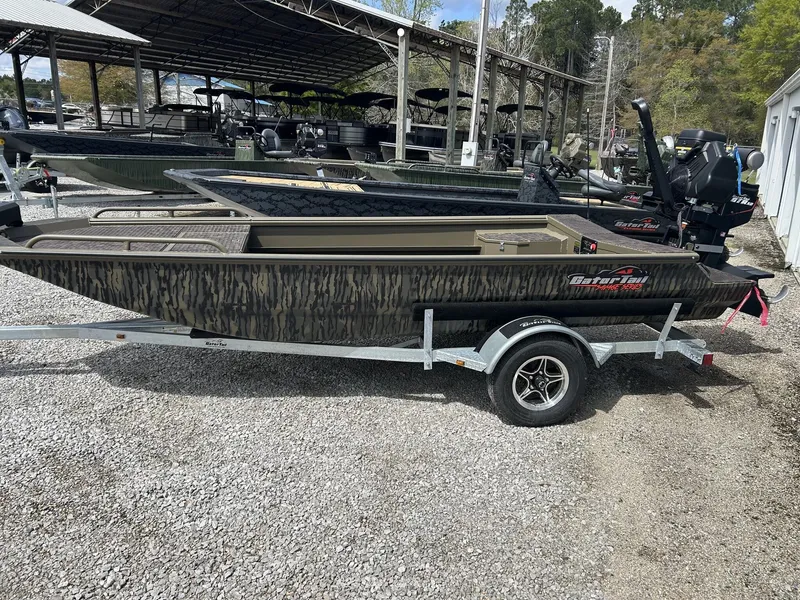 The Image of 2026 Gator Tail Savage Series 1750 boat on trailer outdoors. - 1