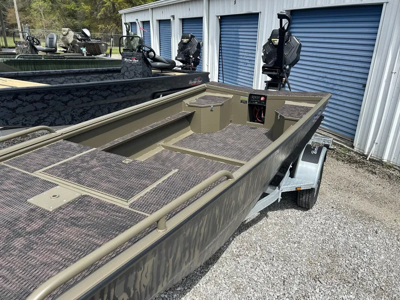 Slide: The Image of 2026 Gator Tail Savage Series 1750 boat on trailer in front of storage units. - 5
