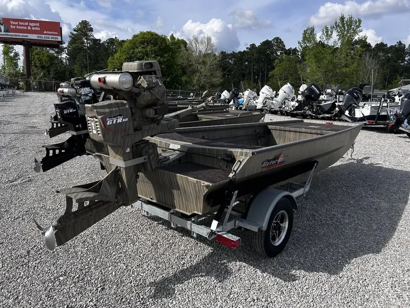 Slide: The Image of Gator Tail Extreme Series 1754 boat, 2026 model, displayed on gravel lot. - 8