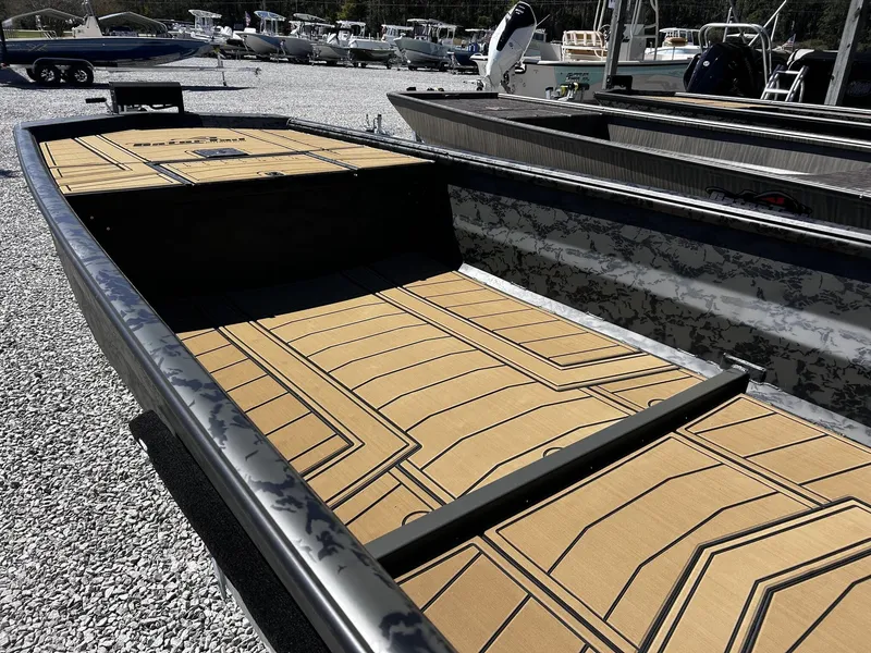 Slide: The Image of Gator Tail Extreme Series 1860 boat, 2026 model, displayed on gravel lot. - 12