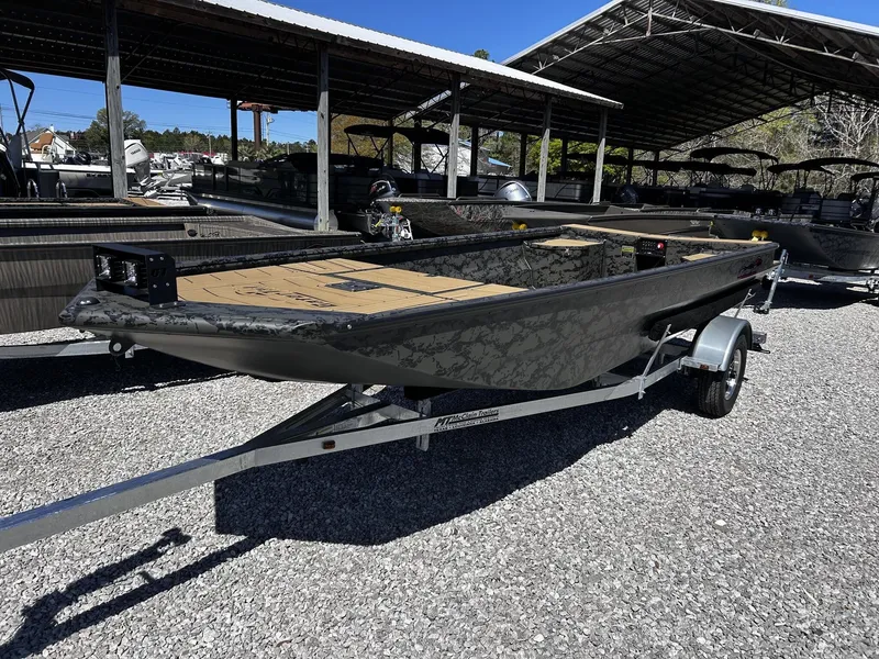Slide: The Image of 2026 Gator Tail Extreme Series 1860 boat on trailer outdoors. - 6