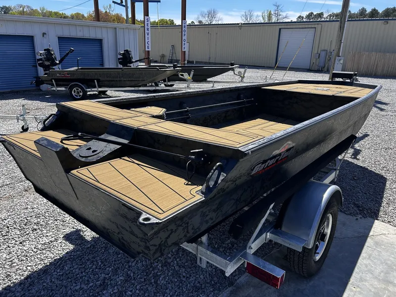 Slide: The Image of Gator Tail Extreme Series 1860 boat, 2026 model, on trailer outdoors. - 8