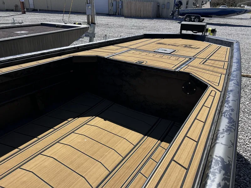 Slide: The Image of Gator Tail Extreme Series 1854 boat, 2026 model, featuring wood-patterned deck. - 3