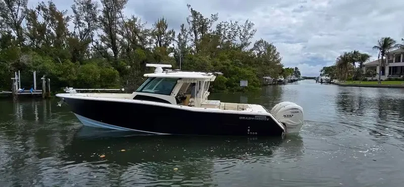 The Image of 2024 Grady-White Canyon 386 boat on a calm river. - 1