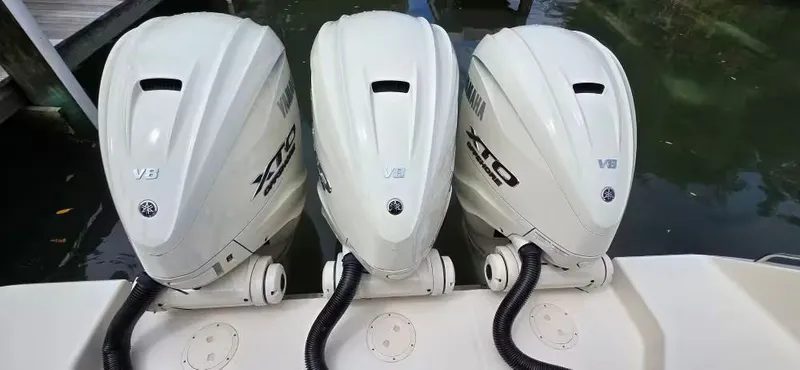 Slide: The Image of Three Yamaha V8 XTO outboard engines on Grady-White Canyon 386, year 2024. - 10