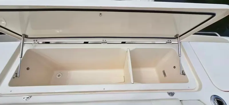 Slide: The Image of Open storage compartment on Grady-White Canyon 386 boat, 2024 model. - 13