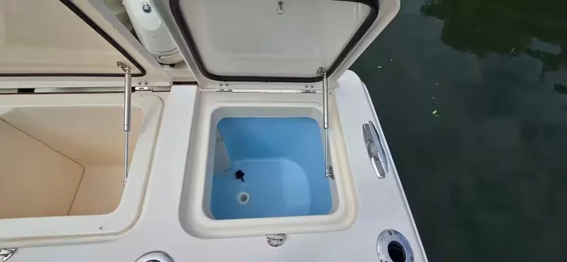 Slide: The Image of Open storage compartments on a 2024 Grady-White Canyon 386 boat. - 14