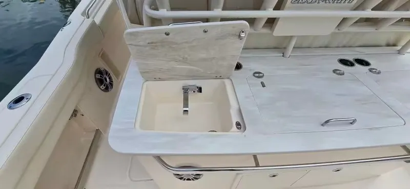 Slide: The Image of Grady-White Canyon 386 2024 featuring integrated sink and countertop. - 18