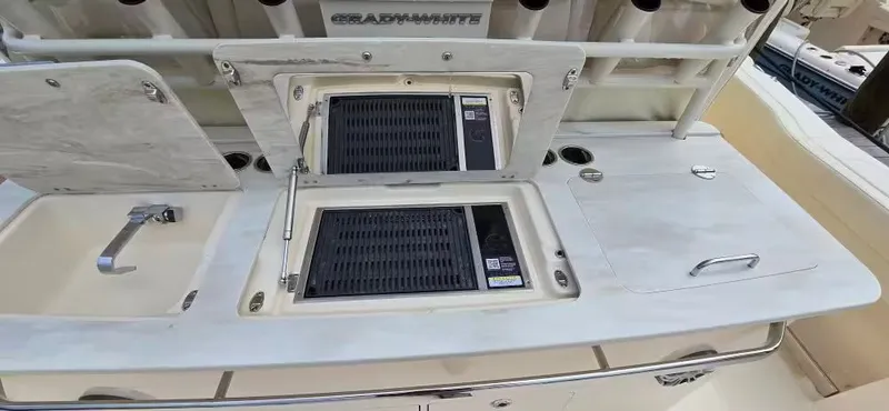 Slide: The Image of 2024 Grady-White Canyon 386 with built-in grill and sink. - 19