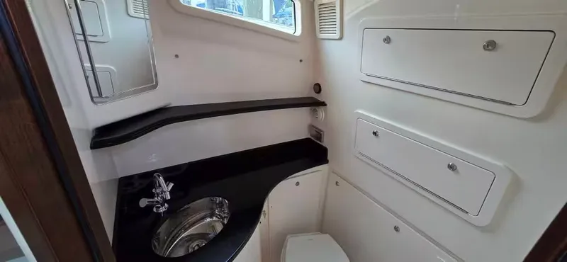 Slide: The Image of Interior of 2024 Grady-White Canyon 386 yacht with sink and storage. - 25