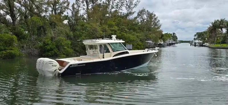 Slide: The Image of 2024 Grady-White Canyon 386 boat on a calm river. - 3