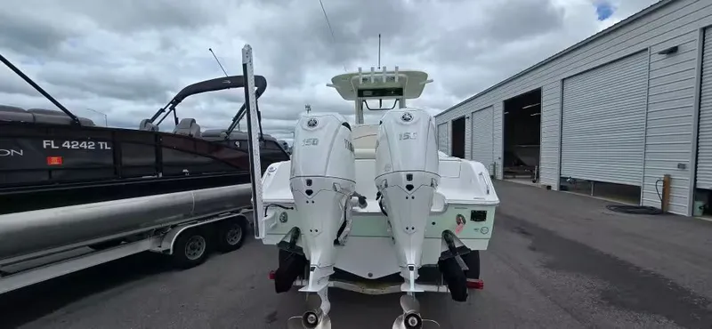 Slide: The Image of Sea Hunt 265 Ultra 2025 with twin outboard engines on a trailer. - 4