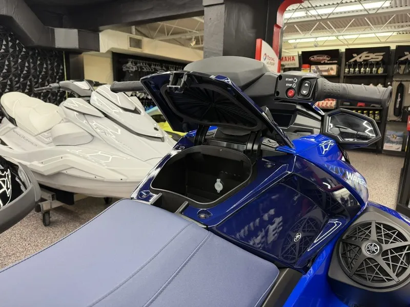 Slide: The Image of Yamaha VX Limited 2026 jet ski with open storage compartment in showroom. - 11