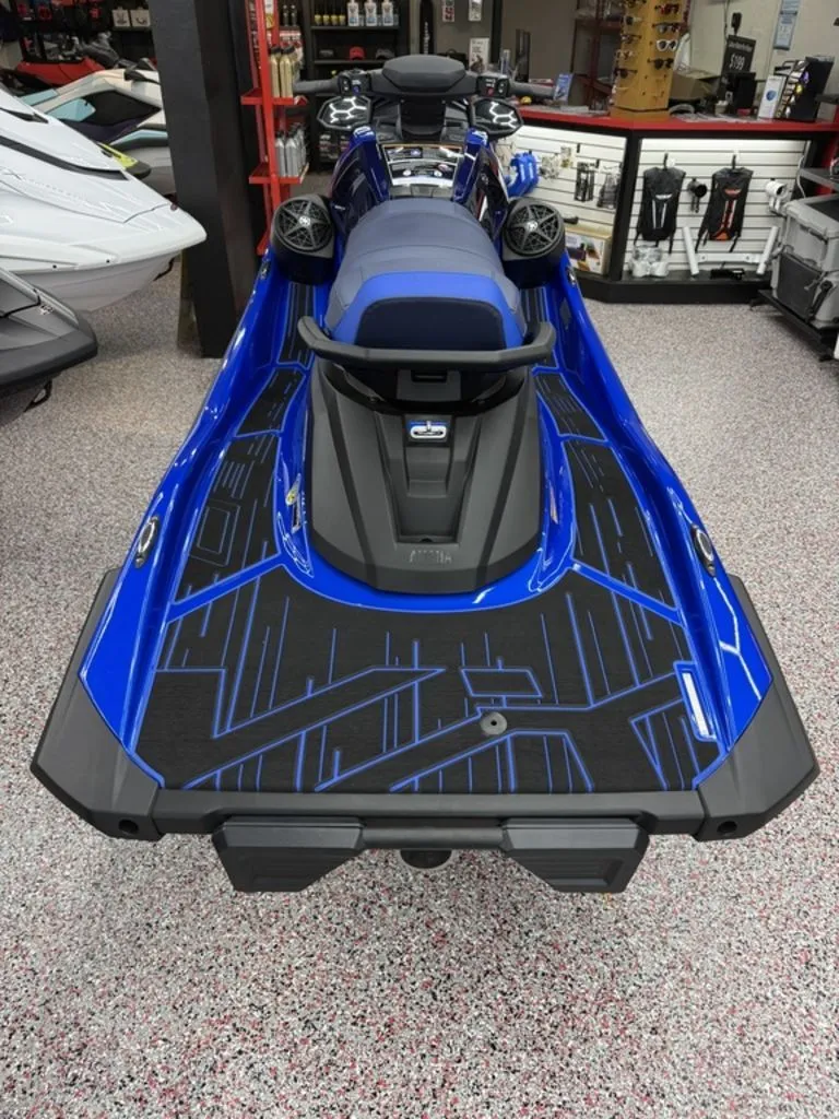 Slide: The Image of 2026 Yamaha VX Limited jet ski in blue, rear view in showroom. - 9