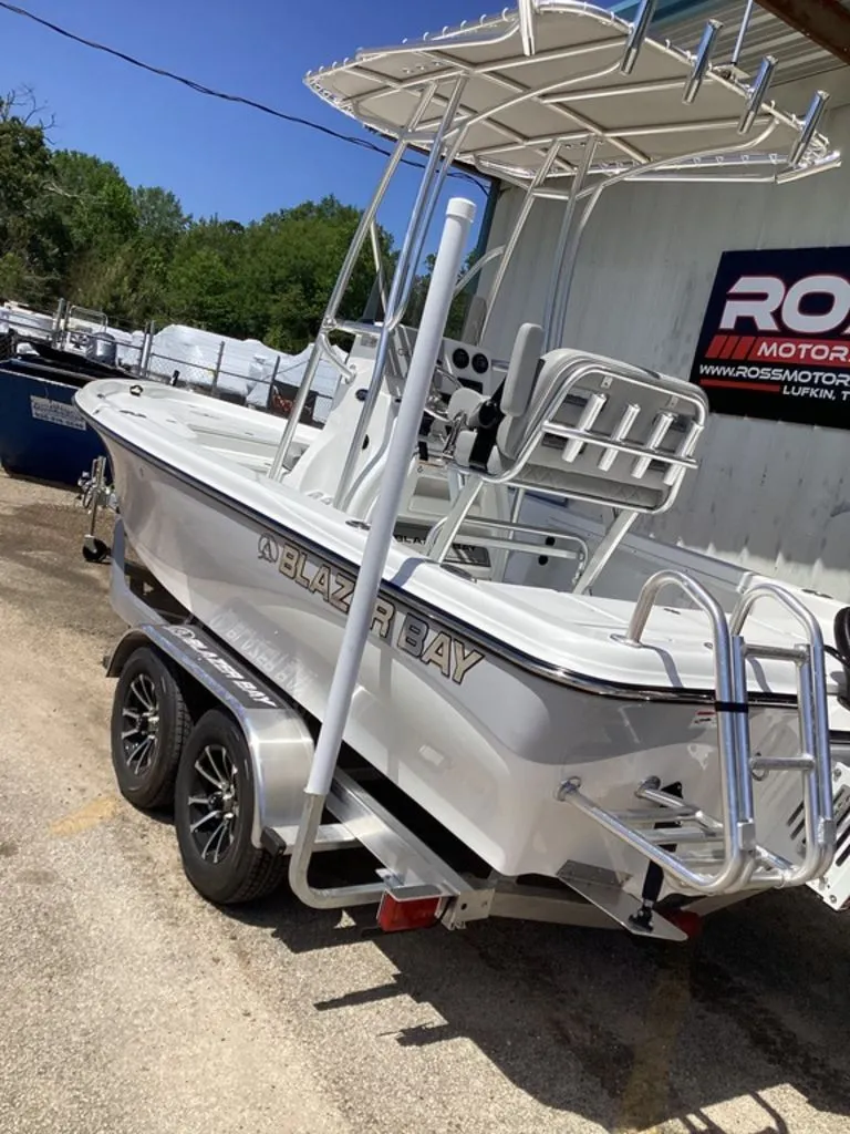 Slide: The Image of 2026 Blazer PureBay 2200 boat parked on trailer. - 2