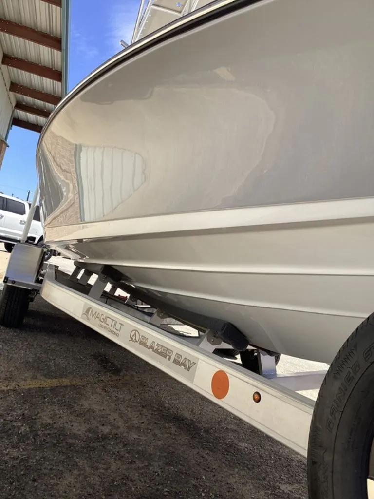 Slide: The Image of 2026 Blazer PureBay 2200 boat on trailer in storage facility. - 20