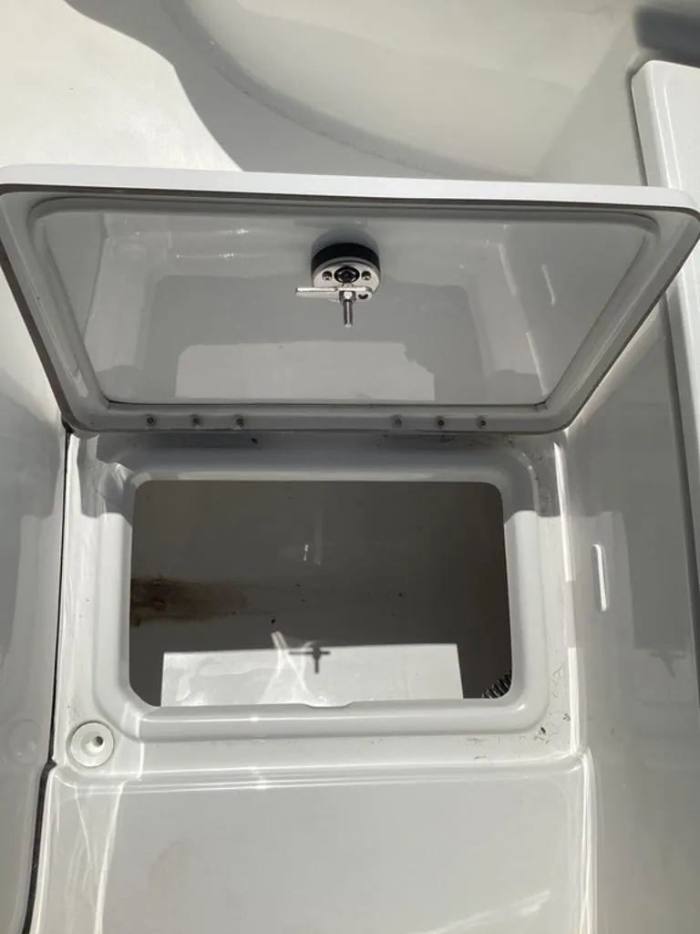 Slide: The Image of Open storage compartment on a 2026 Blazer PureBay 2200 boat. - 39