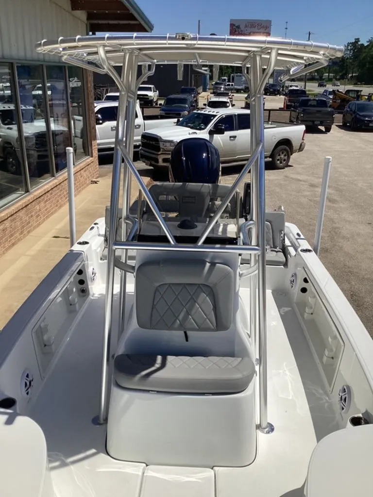 Slide: The Image of 2026 Blazer PureBay 2200 boat with T-top and cushioned seats. - 48