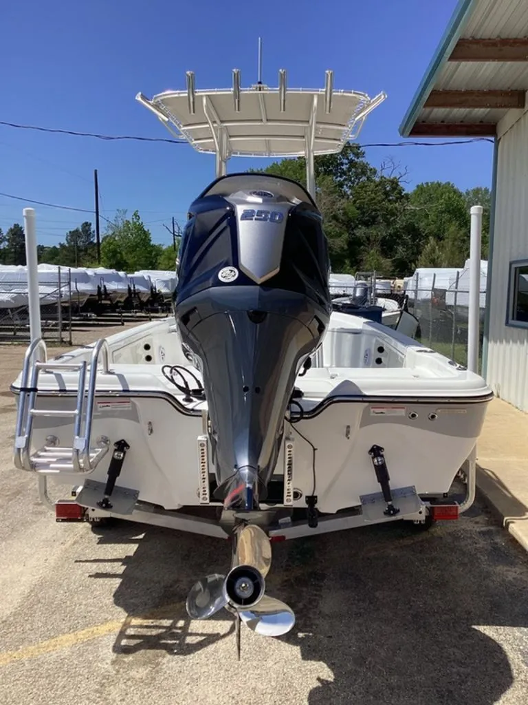 Slide: The Image of 2026 Blazer PureBay 2200 boat with outboard motor, on a trailer. - 6