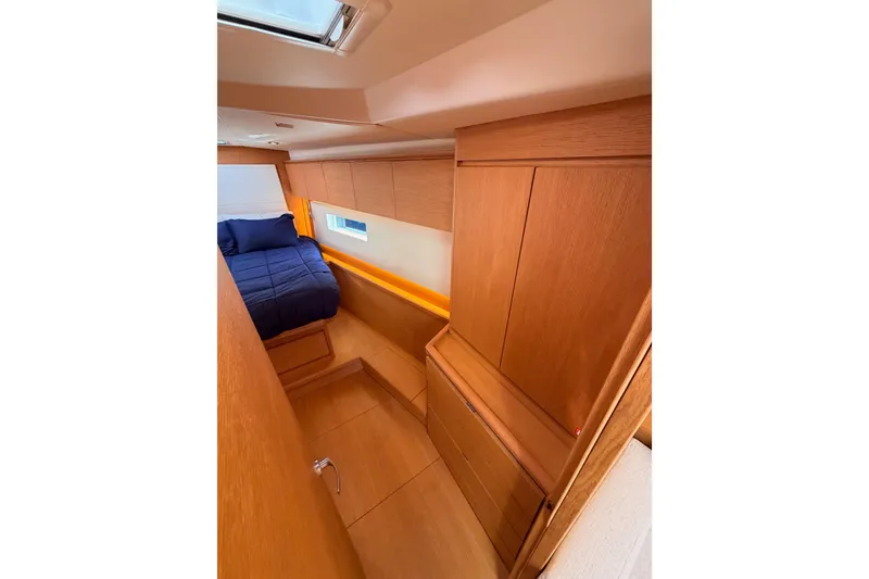 Slide: The Image of Luxurious cabin interior of 2017 Solaris 50 yacht with wooden finish and cozy bed. - 100
