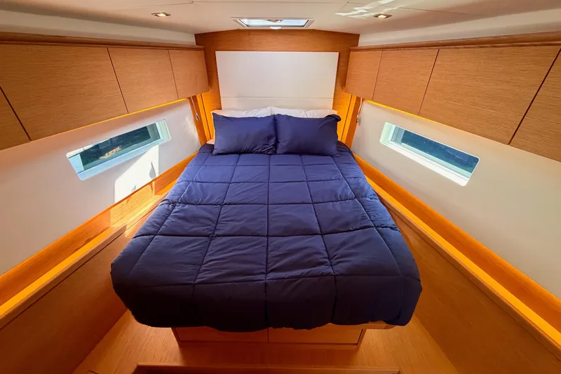 Slide: The Image of Luxurious cabin interior of 2017 Solaris 50 yacht with cozy bed and wooden finish. - 102