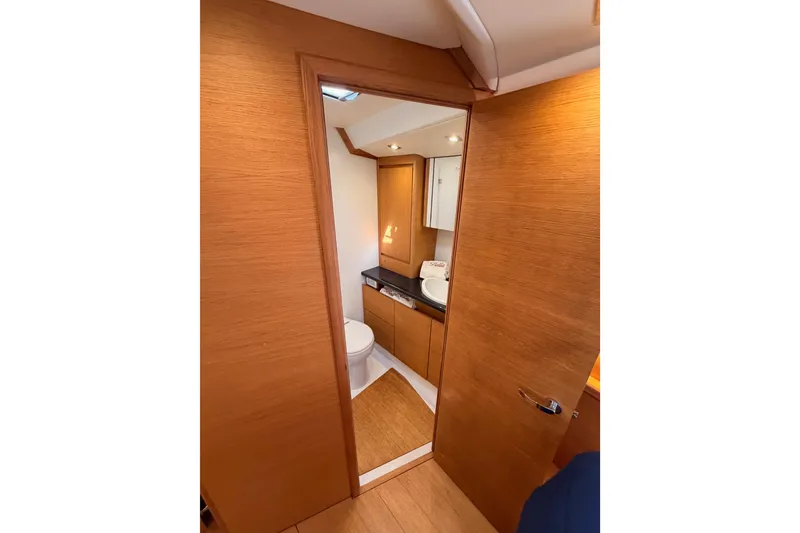 Slide: The Image of Interior view of 2017 Solaris 50 yacht bathroom with wooden finish and modern amenities. - 104