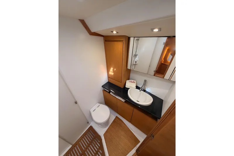 Slide: The Image of Luxurious bathroom in 2017 Solaris 50 yacht with modern fixtures and wooden accents. - 105