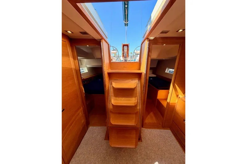 Slide: The Image of Interior view of a 2017 Solaris 50 yacht, featuring wooden cabinetry and cozy cabins. - 111