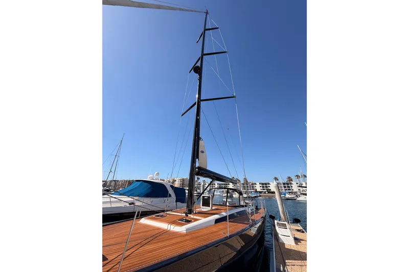 Slide: The Image of Sleek 2017 Solaris 50 yacht docked under clear blue sky. - 13