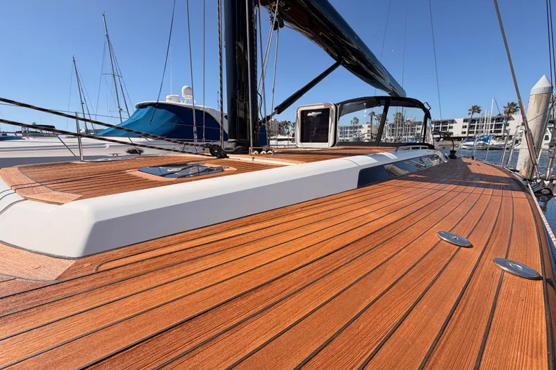 Slide: The Image of Luxurious 2017 Solaris 50 yacht with sleek wooden deck in marina setting. - 14