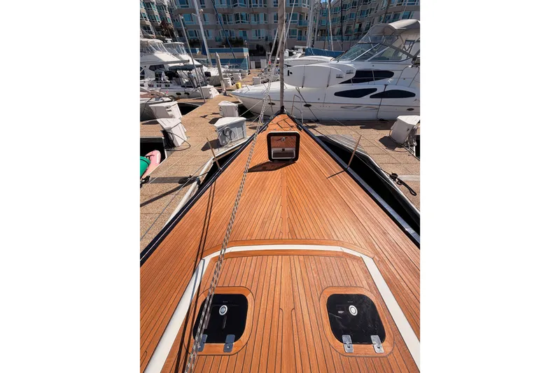 Slide: The Image of Deck view of a 2017 Solaris 50 yacht docked at a marina. - 18