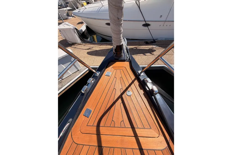 Slide: The Image of Bow of a 2017 Solaris 50 yacht with teak decking in a marina. - 21