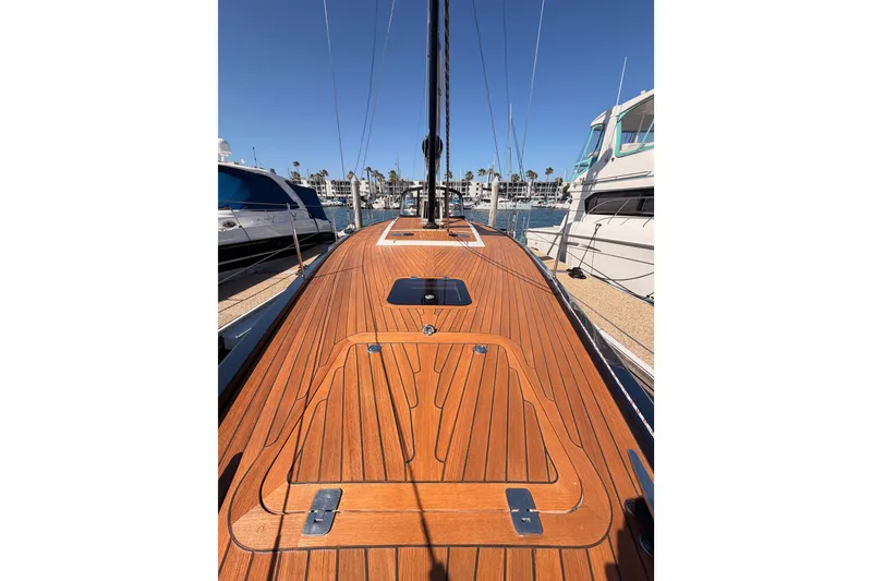 Slide: The Image of Luxurious 2017 Solaris 50 yacht with sleek wooden deck, docked in a marina. - 25