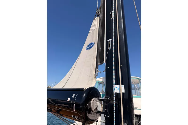 Slide: The Image of Sailing yacht Solaris 50, 2017 model, with sails unfurled against a clear blue sky. - 28