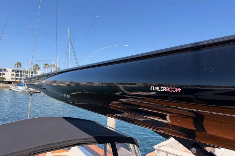 Slide: The Image of Close-up of a 2017 Solaris 50 yacht's sleek black boom with "Furlerboom" branding. - 29