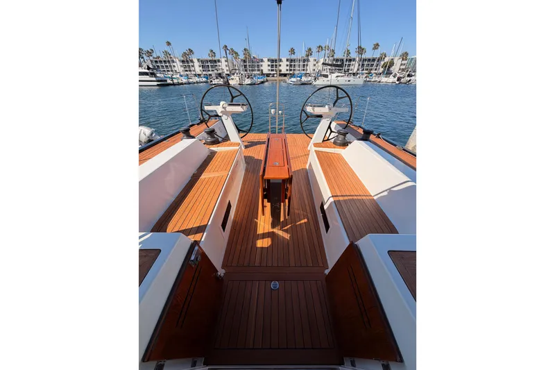 Slide: The Image of Luxurious 2017 Solaris 50 yacht cockpit with dual steering wheels and wooden deck. - 32