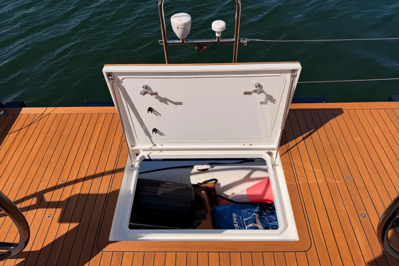 Slide: The Image of Open storage compartment on 2017 Solaris 50 yacht deck, revealing equipment and accessories. - 38