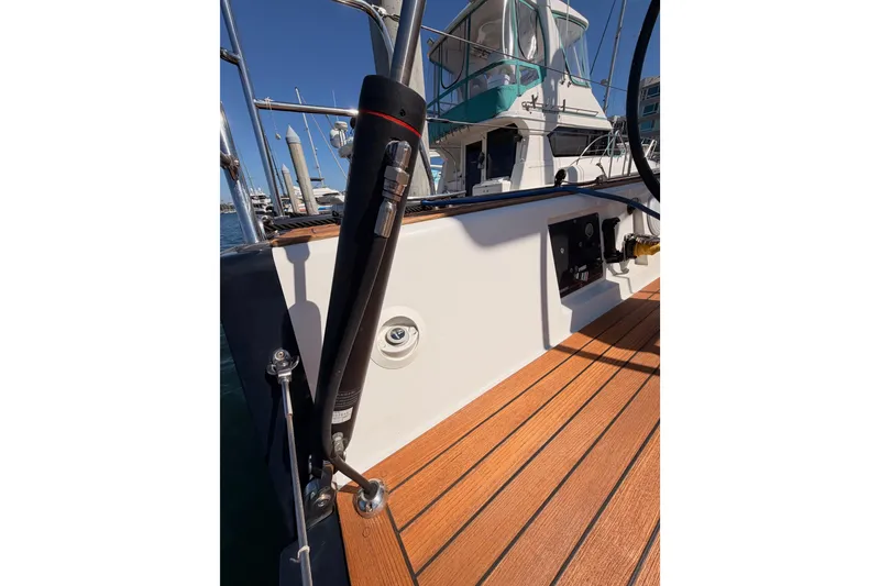 Slide: The Image of 2017 Solaris 50 yacht deck with wooden flooring and marina view. - 43