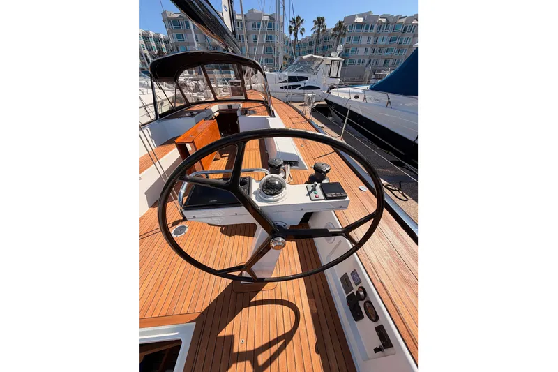 Slide: The Image of Steering wheel of a 2017 Solaris 50 yacht with wooden deck in marina. - 48