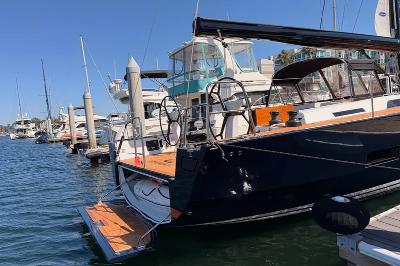 Slide: The Image of Luxurious 2017 Solaris 50 yacht docked at a marina under clear blue skies. - 5