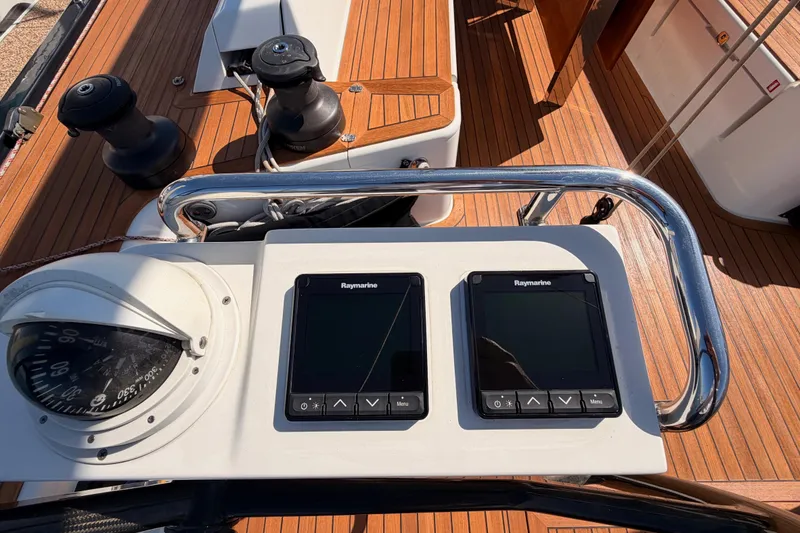 Slide: The Image of Control panel of a 2017 Solaris 50 yacht with Raymarine displays and compass. - 51