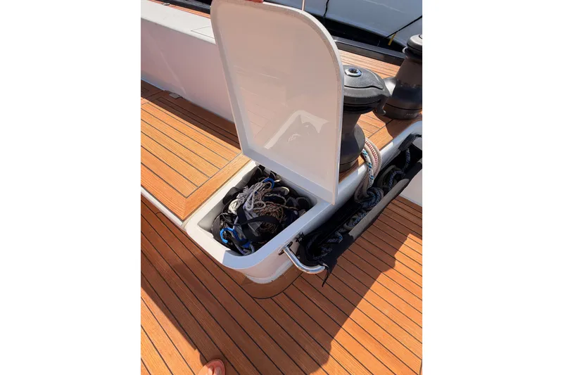 Slide: The Image of Open storage compartment on 2017 Solaris 50 yacht deck with ropes and equipment. - 58