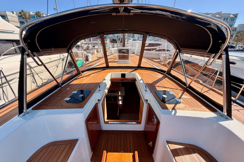 Slide: The Image of 2017 Solaris 50 yacht cockpit with sleek design and wooden deck in marina setting. - 61