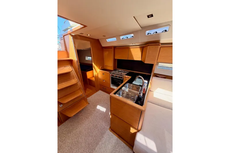Slide: The Image of Luxurious interior of 2017 Solaris 50 yacht featuring modern kitchen and wooden cabinetry. - 65