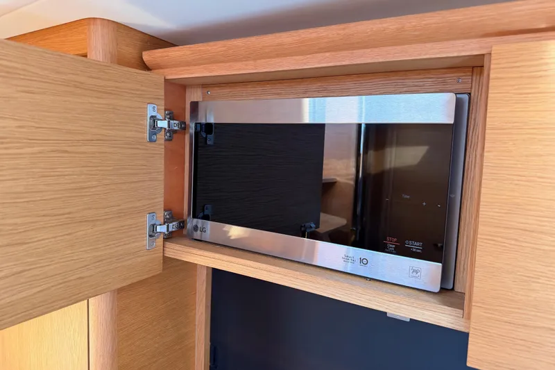 Slide: The Image of Built-in LG microwave in a 2017 Solaris 50 yacht's wooden cabinet. - 70