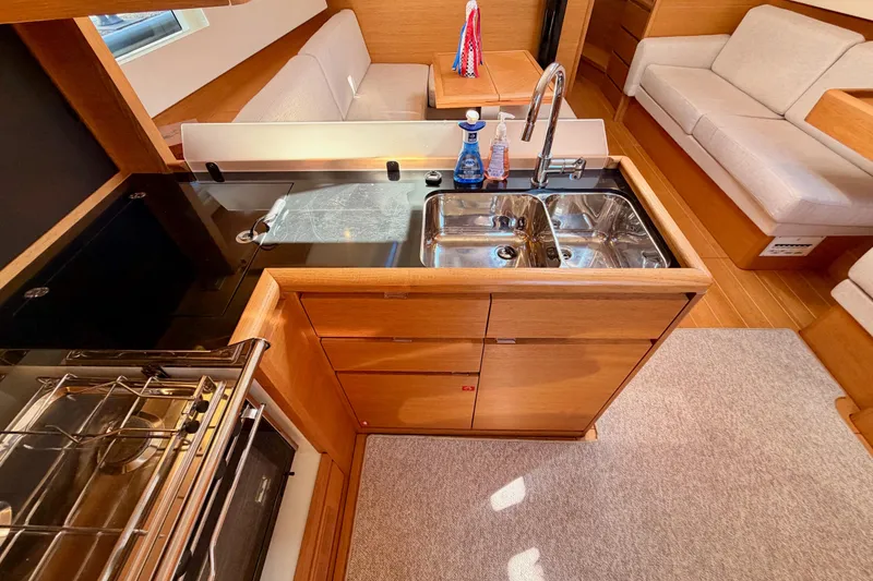 Slide: The Image of Modern kitchen interior of 2017 Solaris 50 yacht with wooden cabinetry and dual sink. - 71